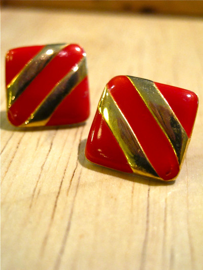  Striking red enamel and gold-tone earrings.
