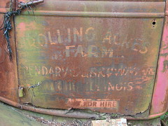 Faded hand lettering on trucks