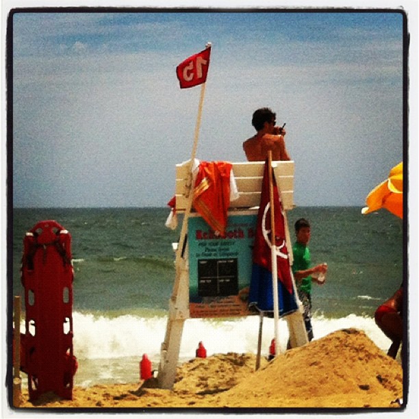 #rehobothbeach Lifeguards at working hard today, huge surf and riptides, 3 rescues in last half hour!