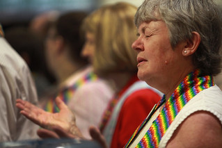 Deborah Maria prays and protests at General Conference. A UMNS photo by Kathleen Berry
