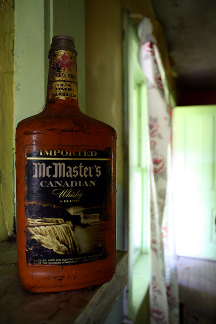 Half gallon bottle of 80 proof McMaster's Canadian Whiskey, half full or half empty, depending on your perspective or philisophical outlook.