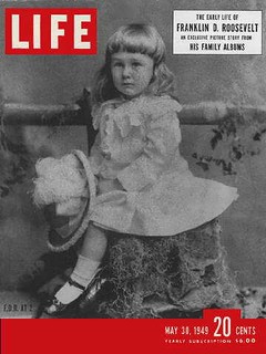 roosevelt as a baby in a white dress and shoes