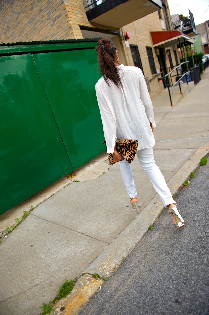 animal print clutch and metallic silver shoes