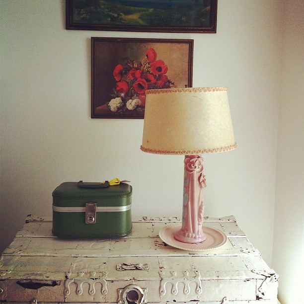 old trunk, funky lamp and lithographs in the guestroom #thisoldhouse #spaces #home #interiors #maine #maineaesthetic