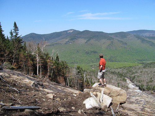 Hiker admiring Big Slide across John's brook valley