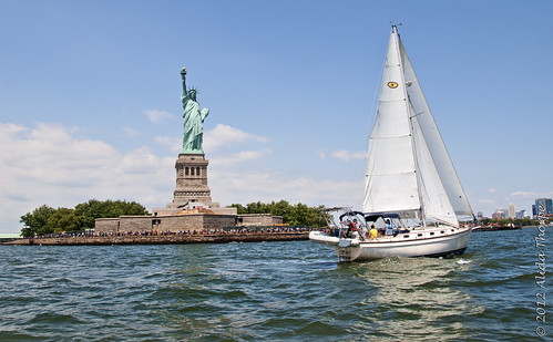 Liberty and the sailboat by Alida's Photos