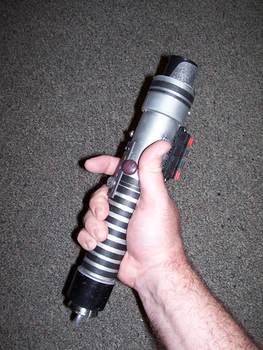 Star Wars props cover light saber in hand by broken toys