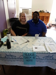 Mosaic volunteers Jeff and Anne at the welcome table