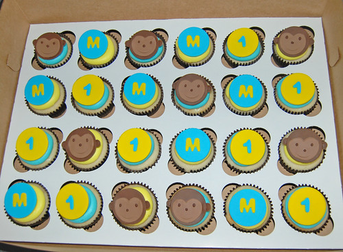 yellow and blue monkey 1st birthday cupcakes