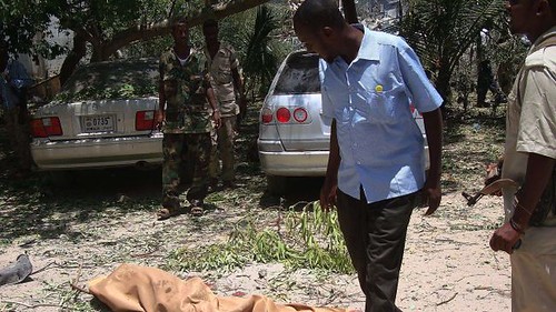 Somalia residents of north Mogadishu walked pass bodies killed in clashes between the US-backed AMISOM and local forces against the Al-Shabab resistance fighters. Despite the announcement that the Islamists are defeated the war continues. by Pan-African News Wire File Photos