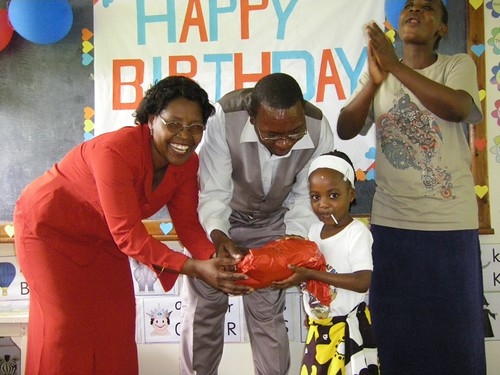 Kay Kodogo receives her present from her new parents