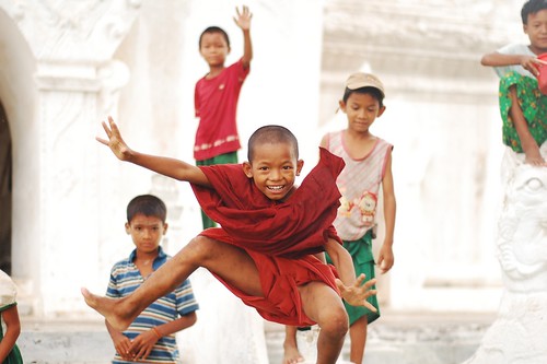 Kid monk in red robes  Myanmar