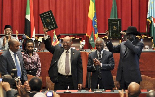 President Omar Hass al-Bashir of the Republic of Sudan at a signing agreement with President Silva Kiir of the Republic of South Sudan where former President Thabo Mbeki mediated. The two oil rich states partitioned in 2011. by Pan-African News Wire File Photos