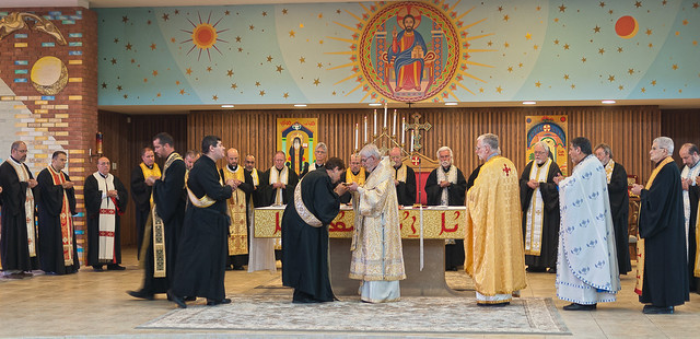 Melkite clergy of the United States recieve Holy Communion, at Saint Raymond's Maronite Cathedral, in Saint Louis, MIssouri, USA