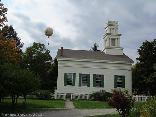 The "Intrepid" flies over the Brooks Grove Methodist Church, Genesee Country Village & Museum, Mumford, New York