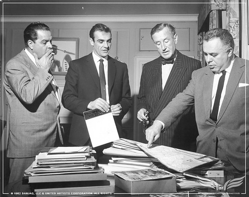 The Establishing Shot CUBBY BROCCOLI, SEAN CONNERY, IAN FLEMING & HARRY SALTZMAN STUDY A MAP OF JAMAICA WHILST SHOOTING DR. NO. © 1962 Danjaq, LLC & United Artists Corporation. All rights copy by Craig Grobler