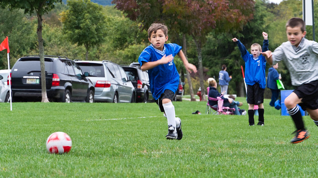 Logan playing soccer