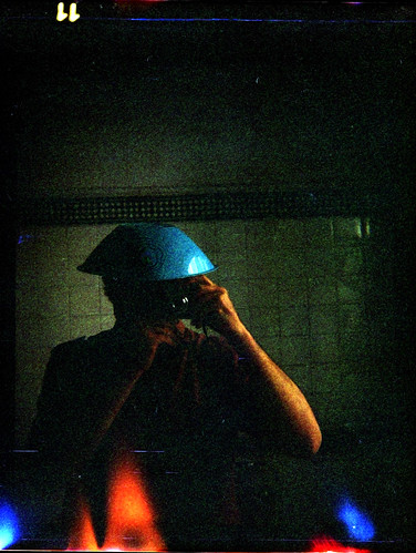 reflected self-portrait with Bencini Comet-S camera and Mallorcan hat by pho-Tony