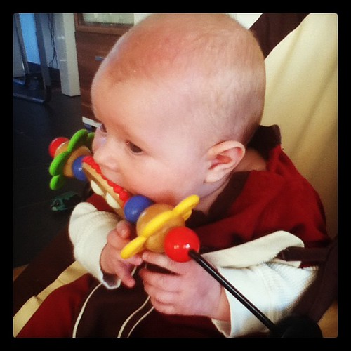 No more relaxing in my bouncer. Gotta lean forward so I can eat my toy. #bjornbabysitter