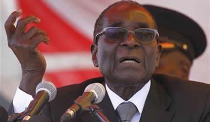 Republic of Zimbabwe President Robert Mugabe addressing mourners at the memorial services for Minister of Education Stanislaus Mudenge who died on October 5, 2012. He will be buried at Hero's Acre. by Pan-African News Wire File Photos