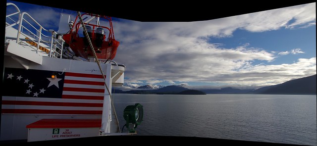 Panorama - Approaching Juneau port on Alaska Marine Highway ferry, MV Columbia. feat Alaska flag