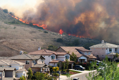 A fire advancing on an urban area