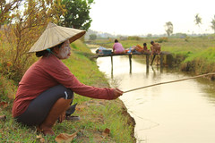 People Fishing On the River