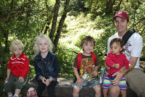 All 4 kids on a bench