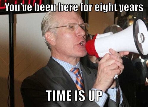 Tim Gunn yelling into a megaphone. Text reads, You've been here 8 years. Time is up.