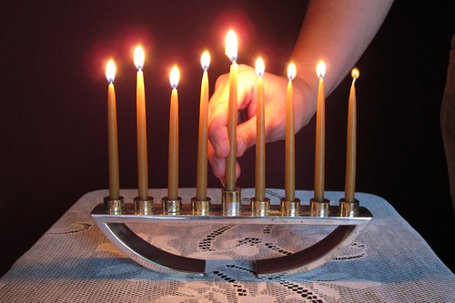 menorah burning with hand.jpg
