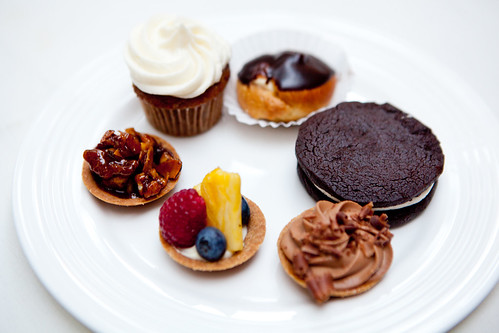 All desserts round: Various mini tarts, Homemade Oreo cookie, mini vanilla cream puff, mini banana cupcake