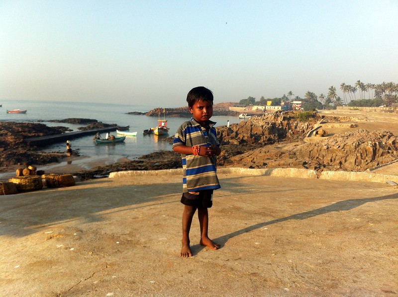 Kid enjoying the sun near Madh fort