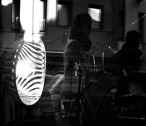 Reflections in a lamp shop window