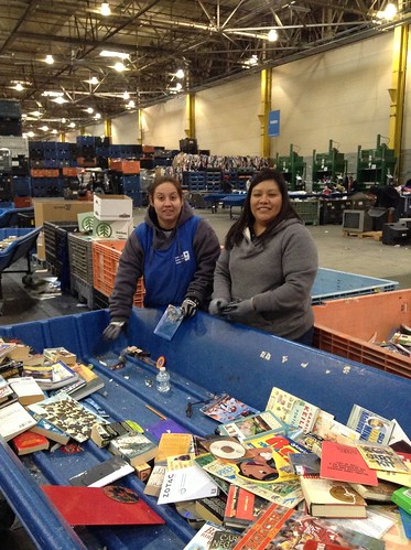 USDA’s Vanessa Garcia (Right) gets sorting instruction from a Goodwill employee