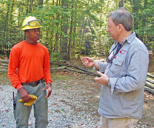 Forest Service Job Corps student Jay Williams learns about pottery found on site from USFS archeologist Andrew Triplett on the Nantahala National Forest on Sept. 29, 2012. As a 0-20 percent slope area, watching for archeological finds was a top priority throughout the project. US Forest Service photo/Holly Krake.