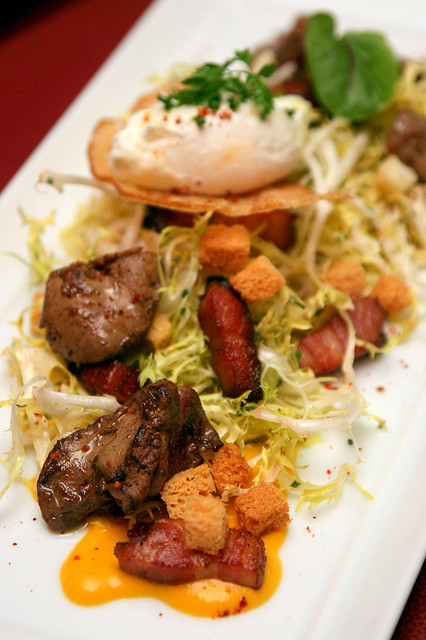 Salade Lyonnaise - Frisee salad, chicken livers, bacon, poached egg, croutons, mustard and carrot dressing