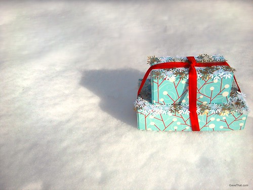 Paper snow capped presents in fresh powder
