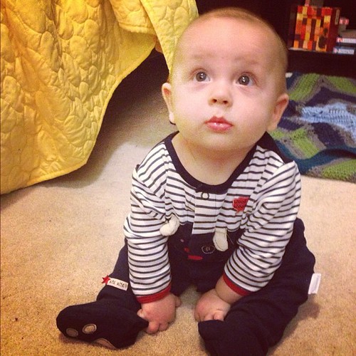 Five months! Little cutie is practicing his new skill, sitting up, before bed!