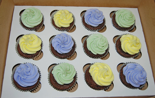 pastel purple yellow and green baby shower cupcakes