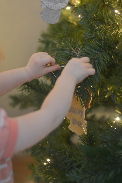Violet hanging her ornament