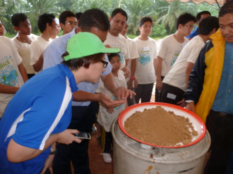 Children enjoying a traditional meal prepared by the villagers.JPG