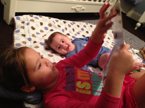 Hannah reading to her brother