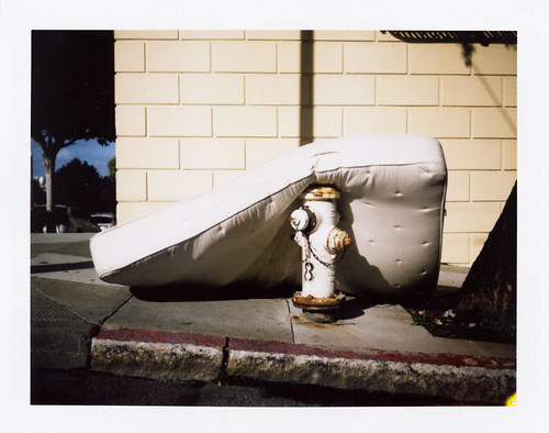mattress laying on hydrant