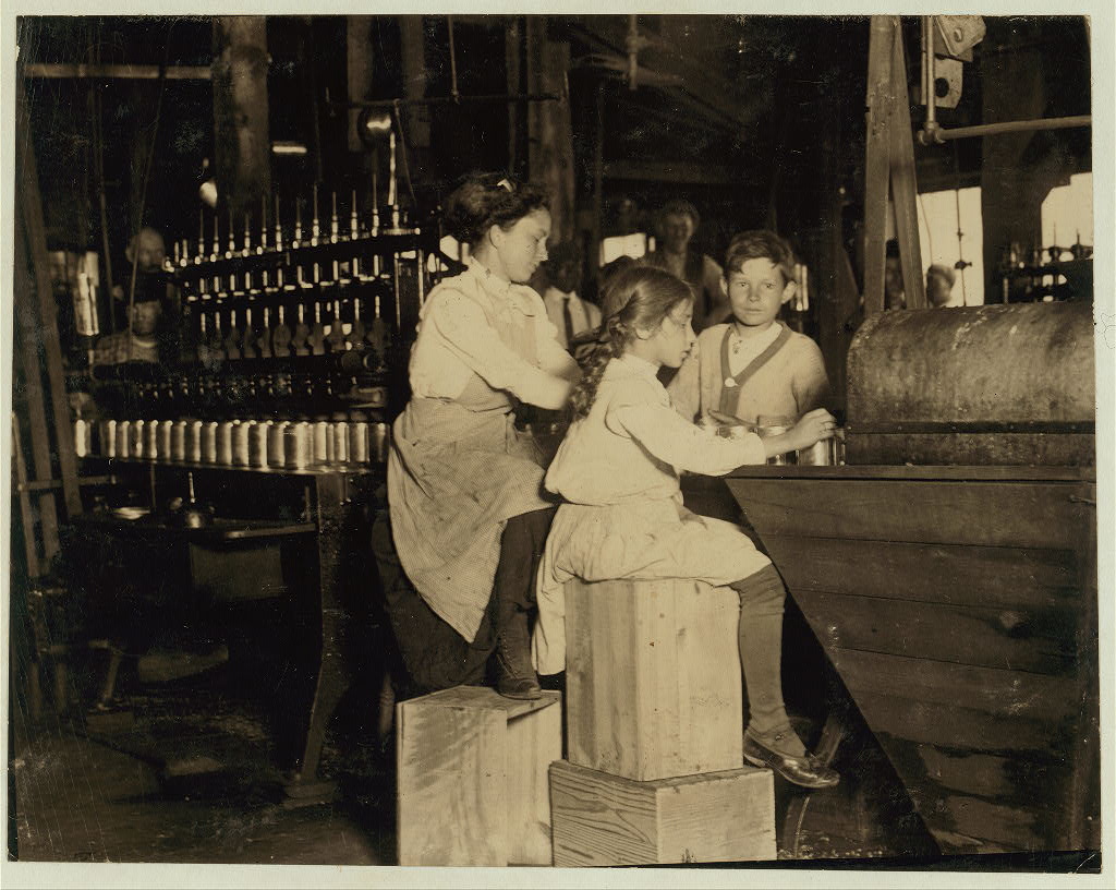 Daisy Langford, 8 yrs. old works in Ross' canneries. She helps at the capping machine, but is not able to "keep up." She places caps on the cans at the rate of about 40 per minute working full time. This is her first season in the cannery. Location: Seaford, Delaware.