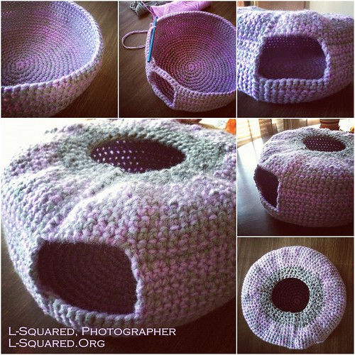 Pale-purple and grey igloo-shaped cat bed with an arched opening in the side and a round opening in the top.