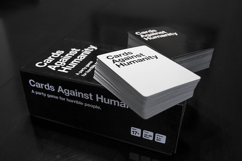 image of black-and-white cards and a box reading "Cards Against Humanity"