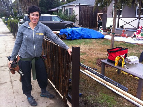 Our neighbor, Maria, builds a fence