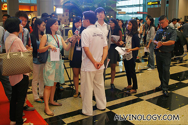 Mr Peh getting bombarded by the media after the event 