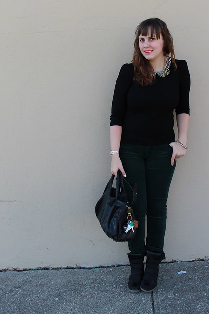 Christmas Eve Eve Outfit: Black sneaker wedges, green AG corduroys Black sweater with delicate shoulder-pad detail, Peter-Pan-collar necklace