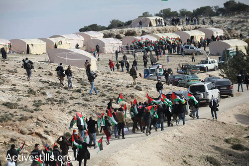 Activestills photo of Palestinian activists arriving today at Bab Al-Shams tent village